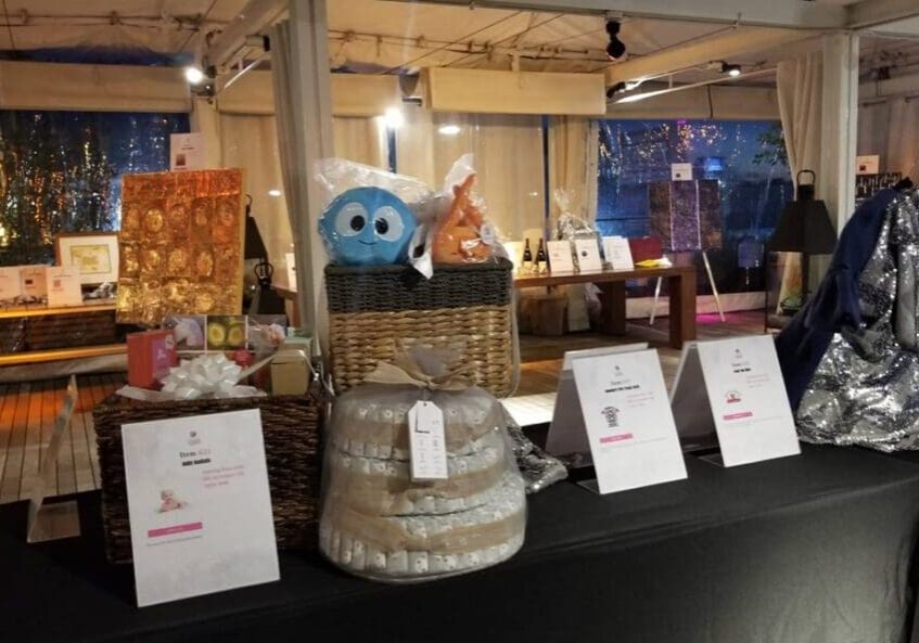 A table with several different types of cakes on it.